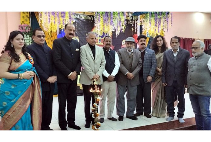 Dignitaries posing along with school management during a programme.