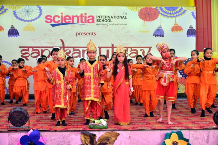 Students displaying a vibrant cultural performance during a programme at Scientia International School.