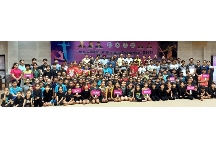 Gymnasts from different districts posing during opening ceremony of J&K UT Gymnastics Championships 2024-25. Gymnasts from different districts posing during opening ceremony of J&K UT Gymnastics Championships 2024-25.