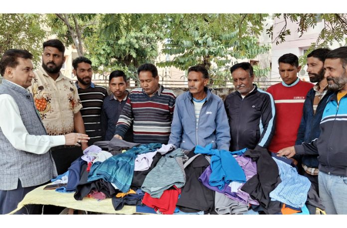 BJP leader, Balbir Ram Rattan interacting with street vendors in Jammu on Tuesday.