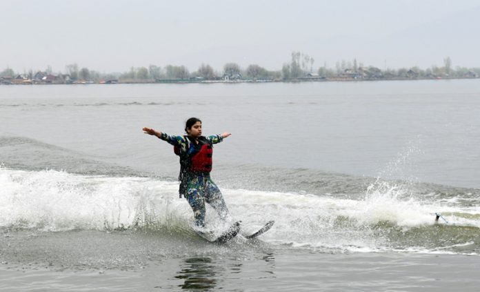 A skier displaying her skill on Dal lake during water Skiing Championshop at Srinagar. - Excelsior/Shakeel