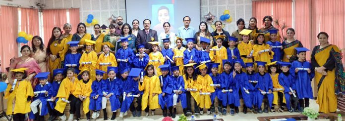 Students posing along with dignitaries during a programme.