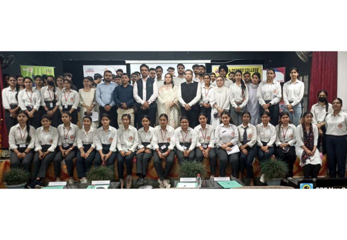 Students posing along with dignitaries during a programme. Students posing along with dignitaries during a programme.