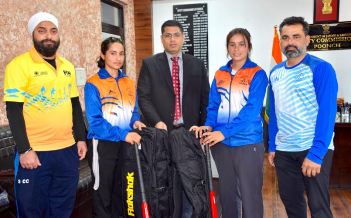 Hockey players receiving equipments from DC Poonch Vikas Kundal.