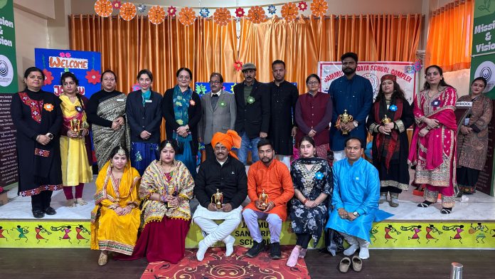 Teachers of different schools posing during a program.