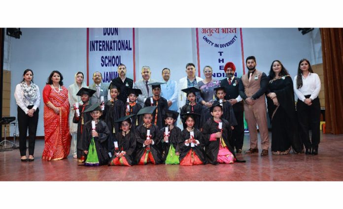 Students posing with school management and dignitaries during 8th Kinder Carnival.