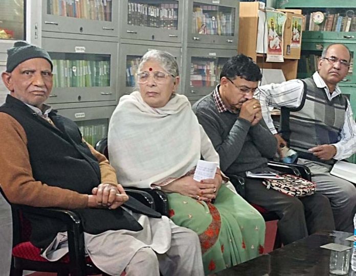 Kashmiri Pandit community posing during a programme.