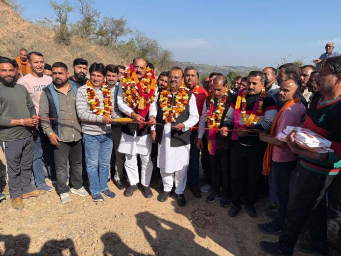 MLAs Chander Parkash Ganga and Surjit Singh Salathia kick starting construction work of a road in Samba on Saturday.