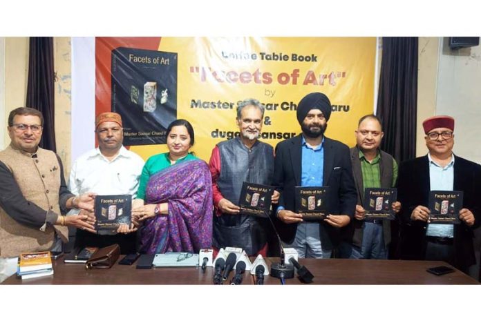 Dignitaries releasing Coffee Table Book 'Facets of Art' in Jammu on Saturday.