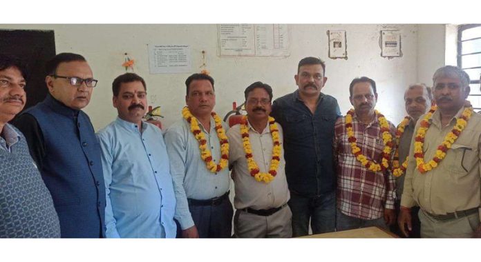 Newly elected office bearers of PHE Workers Welfare Association, Jammu posing for a group photograph.