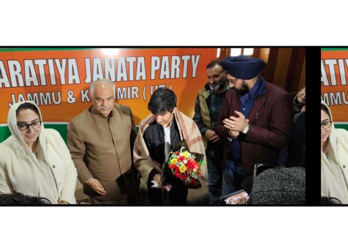 BJP leaders posing with budding Kashmiri singer Aayan Sajad after honouring him in Srinagar on Saturday. BJP leaders posing with budding Kashmiri singer Aayan Sajad after honouring him in Srinagar on Saturday.