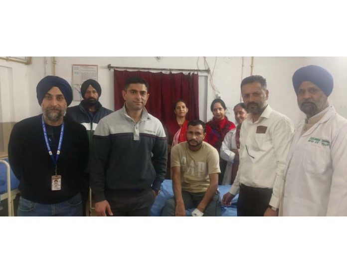 Dr Kanav Padha and his team posing with a patient on whom they performed revised total hip replacement.