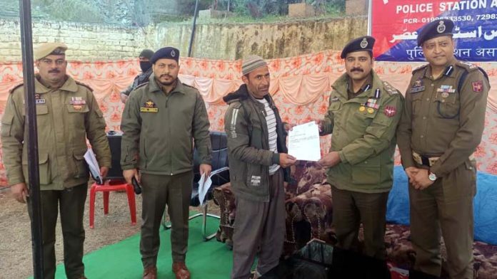 DIG Shridhar Patil giving Character Certificates to the applicants who had applied for these at Police Station Assar. -Excelsior/Tilak Raj