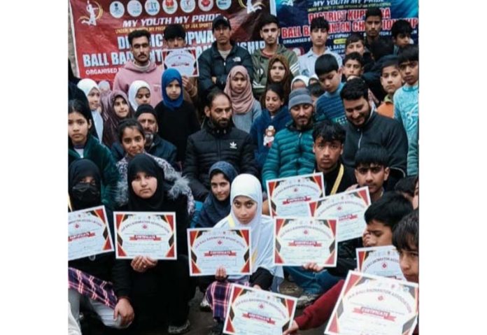 Players display their certificates on culmination of Kupwara Ball Badminton Championship.