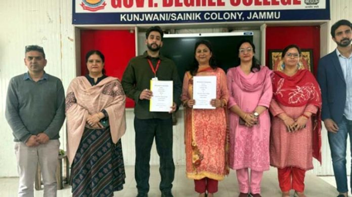 Officials of GDC Kunjwani and CT University, Ferozepur, Ludhiana pose for a photograph after signing a MoU.