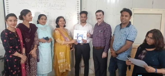 Management of GDC Marh presenting certificates to winners during the poetry recitation competition.