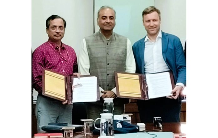Officials of DFB and Prasar Bharati posing for a photograph with the letter of exchange in New Delhi. Officials of DFB and Prasar Bharati posing for a photograph with the letter of exchange in New Delhi.