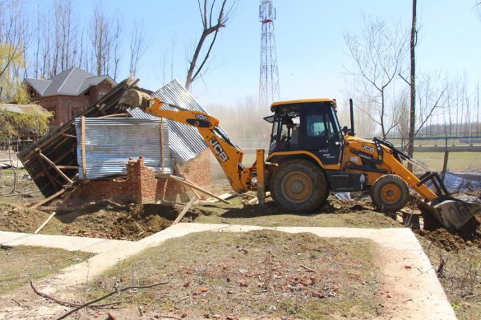 House of terrorists handler being demolished in Anantnag. -Excelsior/Sajad Dar House of terrorists handler being demolished in Anantnag. -Excelsior/Sajad Dar