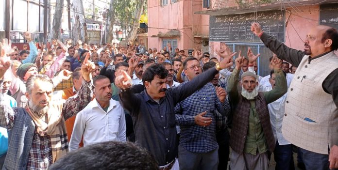 PHE workers staging protest at Udhampur on Tuesday.