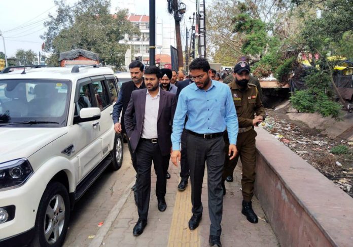 DC Jammu and JMC Commissioner on way to inspect canal desilting operations.