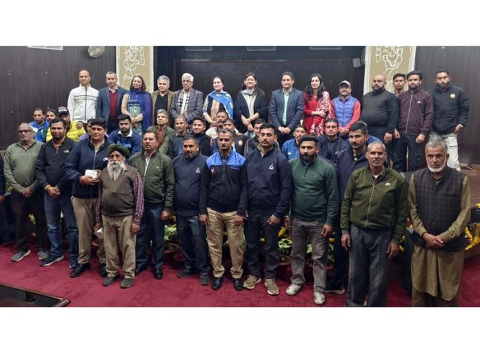 VC JU Prof Umesh Rai posing with multi-tasking staff of the University during an event.