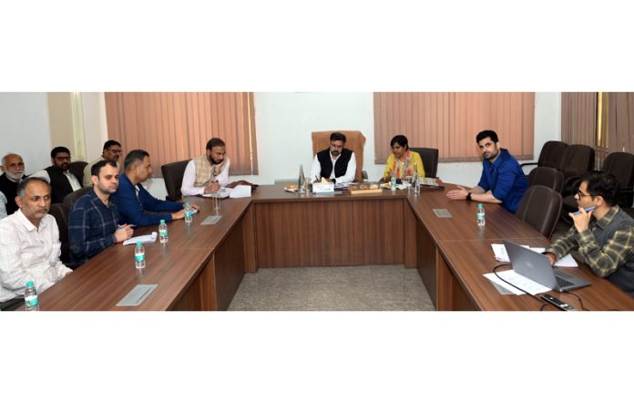 Minister Satish Sharma chairing a meeting on Wednesday.