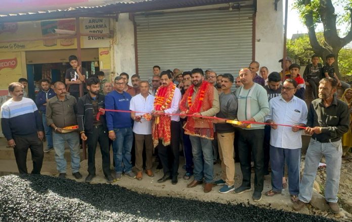 MLA Pawan Gupta inaugurating the blacktopping work at Nagrota Kallar on Sunday.