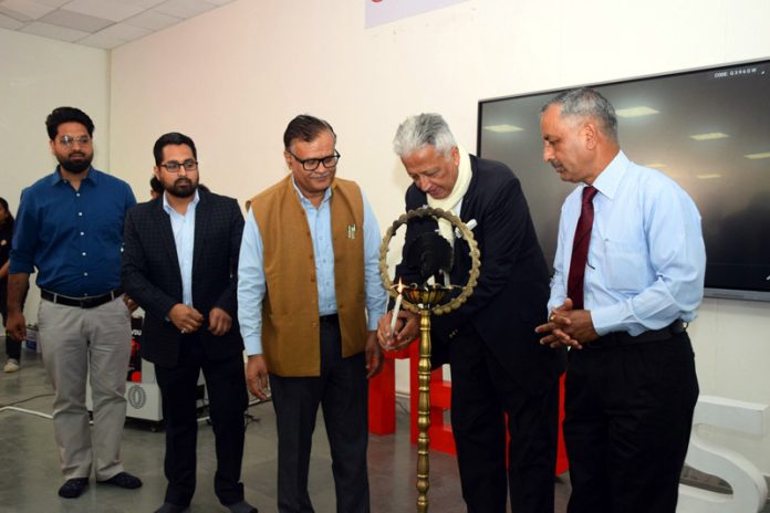 Guests lighting ceremonial lamp during TEDx 2025 at SMVDU. Guests lighting ceremonial lamp during TEDx 2025 at SMVDU.