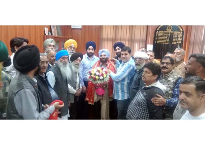 A delegation of Transporters led by Karan Wazir felicitating new RTO, Jammu, S Jasmeet Singh on Wednesday. A delegation of Transporters led by Karan Wazir felicitating new RTO, Jammu, S Jasmeet Singh on Wednesday.