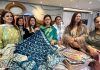 Senior BJP leader Rekha Mahajan posing along with others in an exhibition on Sunday.