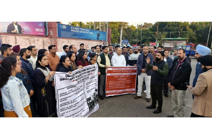 Bank employees under banner of UFBU staging protest in Jammu on Friday.