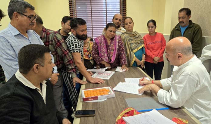 MLA Yudhvir Sethi interacting with people during Janata Darbar in Jammu on Friday.