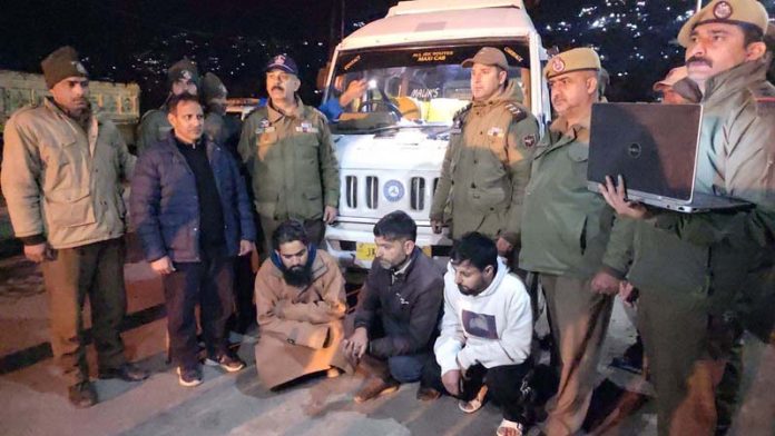 Police alongwith arrested persons from whom heroin like drug was recovered in Doda on Wednesday. -Excelsior/Tilak Raj