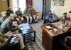 SSP Doda, Sandeep Mehta chairing a meeting at Bhaderwah on Tuesday. -Excelsior/Tilak Raj