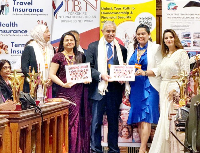 Pallavi Vimal Joshi receiving an award from MP Padma Shri Bob Blackman.
