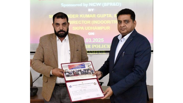 SSP Rajinder Kumar Gupta presenting certificate to a police officer at SKPA Udhampur on Saturday.