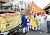 Pawan Kumar Shastri flagging off bus to Haridwar on Thursday.
