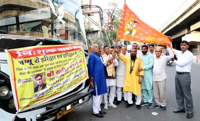 Pawan Kumar Shastri flagging off bus to Haridwar on Thursday.