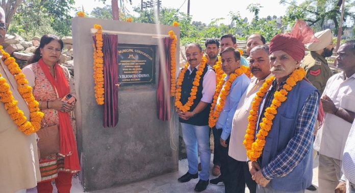 Choudhary Vikram Randhawa inaugurating a lane and drain work in Shiv Nagar locality on Friday.