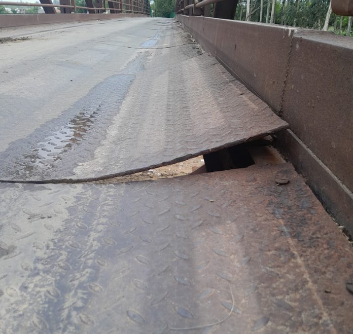 A view of the damaged iron bridge on Balol Nallah in Jammu.