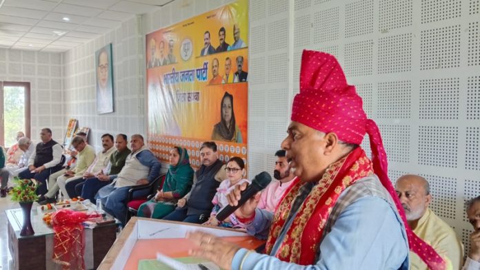 Sat Sharma addressing party workers during a Karyakarta Sammelan in Samba district on Saturday.