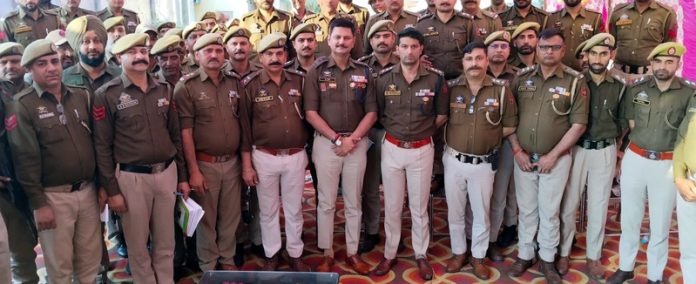 SP City South Ajay Sharma posing for a photograph with the officers & jawans at Jammu on Friday.