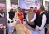 A volunteer donating blood at a camp organised by Sant Nirankari Mission in Muthi Rakwalan on Sunday.