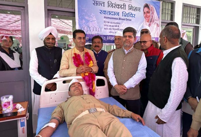 A volunteer donating blood at a camp organised by Sant Nirankari Mission in Muthi Rakwalan on Sunday.