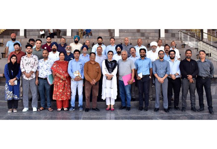 Secretary JKSC, Nuzhat Gul posing with officials of various sports disciplines at MA Stadium in Jammu on Sunday.