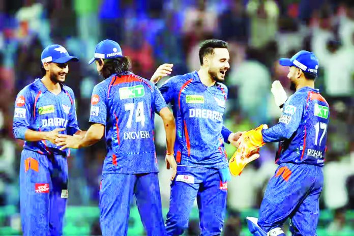 Team members of LSG celebrating after defeating MI at Lucknow on Friday.