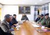 DC Leh Santosh Sukhadev chairing a meeting in Leh on Friday.