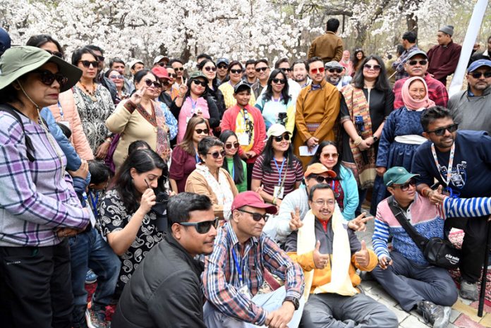 DC Kargil Shrikant Suse posing along with tourists on inaguration of Apricot Blossom Festival in Kargil on Friday. DC Kargil Shrikant Suse posing along with tourists on inaguration of Apricot Blossom Festival in Kargil on Friday.