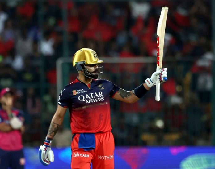 Virat Kohli raising his bat after scoring 70 runs in 42 balls against RR at Bengaluru. Virat Kohli raising his bat after scoring 70 runs in 42 balls against RR at Bengaluru.