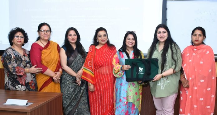 Guests and women artisans posing together during a workshop at IIT Jammu.